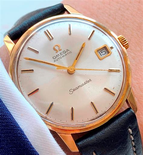 omega 14k gold watch price.